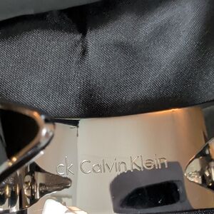 Calvin Klein Polished Silver And Black Logo Bangle